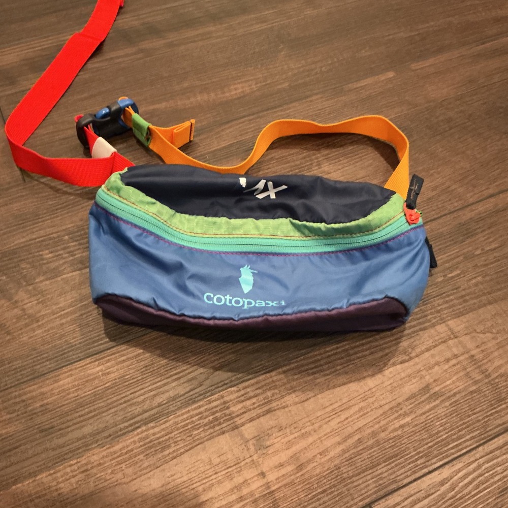 cotopaxi blue green orange red belt bag